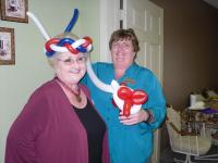 Vickie and Georgia show off the balloon man's creations